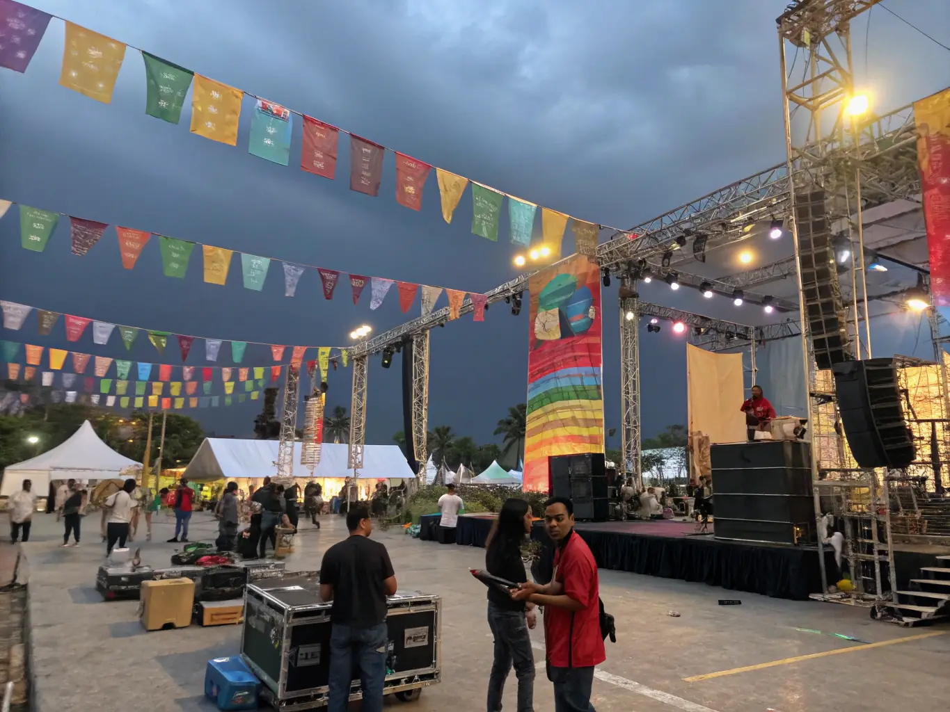 An image showing a team coordinating logistics at a cultural festival, highlighting the organizational support offered by ACHAMEAU ASS CHANSON MUSIQUE EVENEMENT AUDIO.